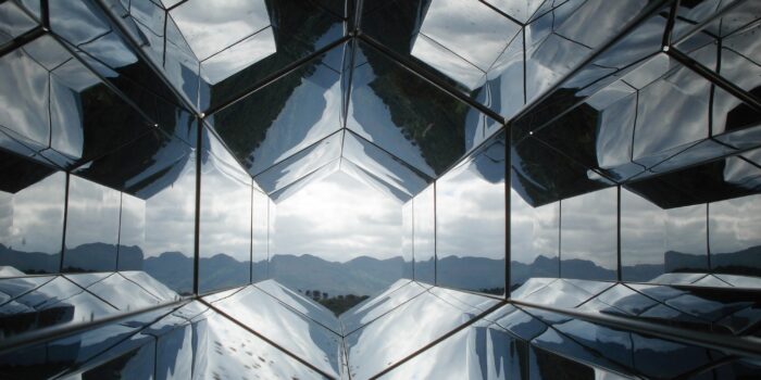 Mirrors with mountains in background.