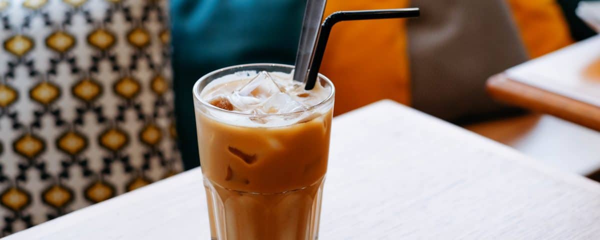 Iced coffee with straw.