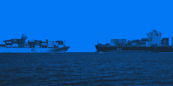 Two cargo ships on blue background.