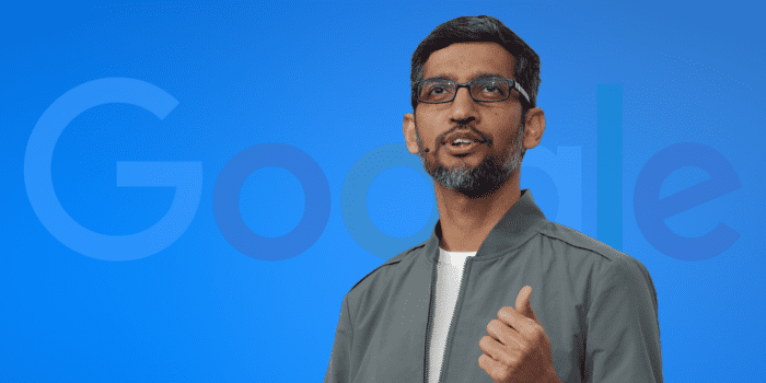 Man speaking with Google logo in background.