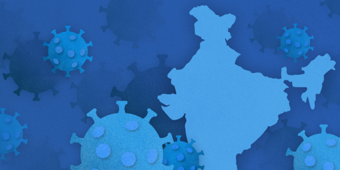 Illustrative image showing virus icons surrounding the shape of India